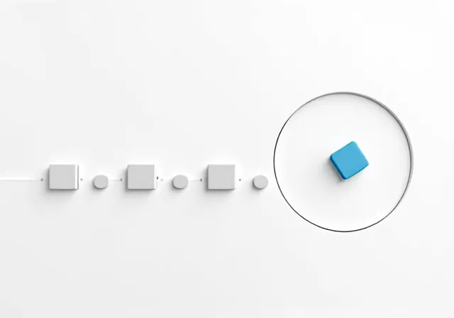 Small dark outlined pieces link into a chain, with a blue piece set apart for closer inspection.